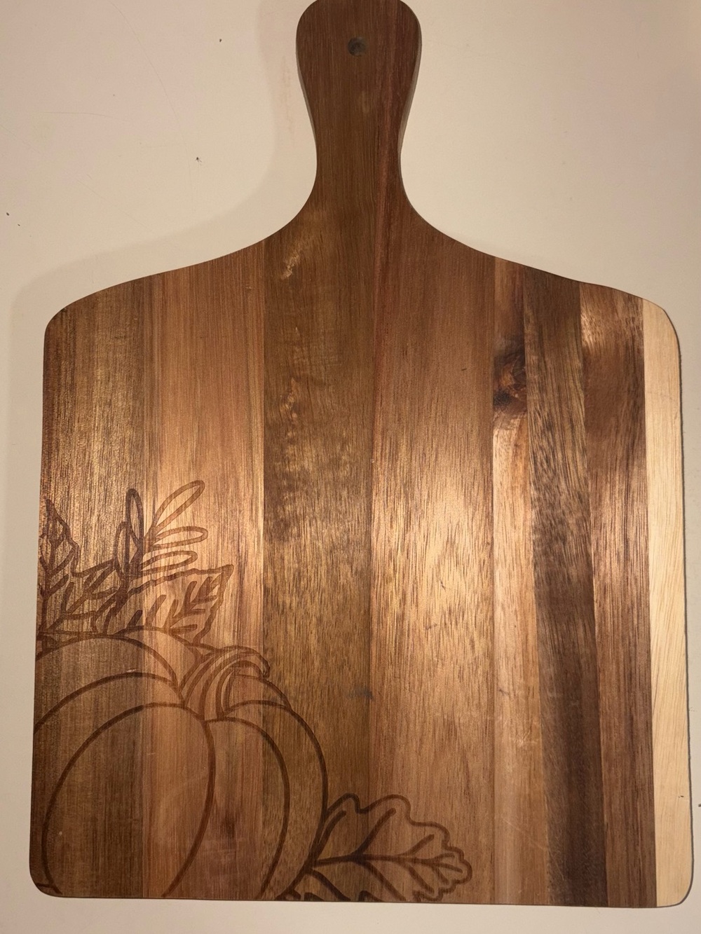 Cutting board with pumpkin engraving